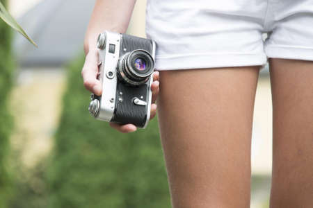 Person Holding Black and White Camera