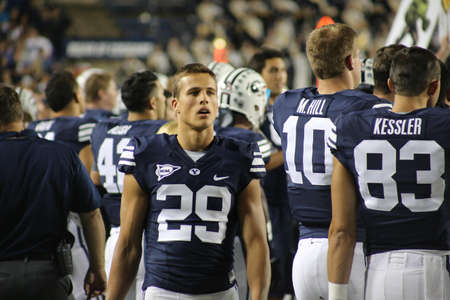 Man Walking Behind His Teammates