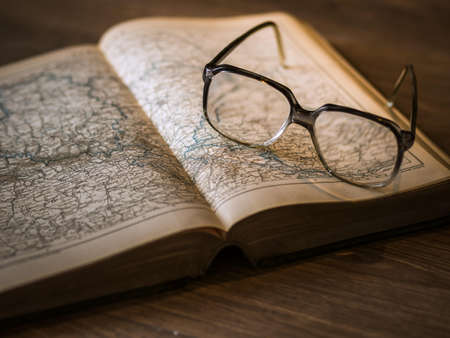 Black Framed Eyeglasses on Book