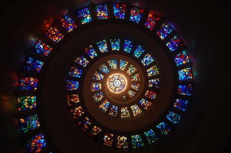Worms Eye View of Spiral Stained Glass Decors Through the Roof