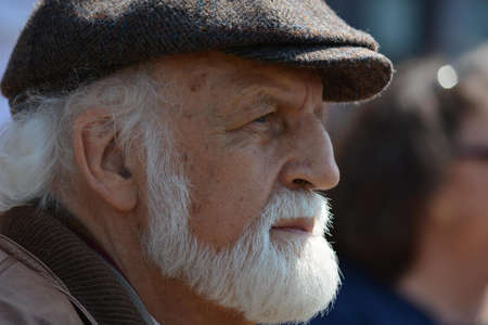 Selective Focus Photography of Man in Flat Cap during Daytime