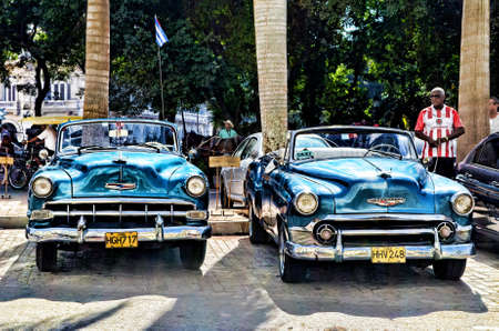 Blue Convertible Vintage Car Parked during Daytime