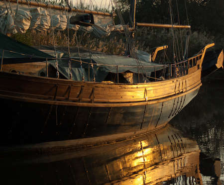 Brown and Black Wooden Sailing Boat Floating on Water