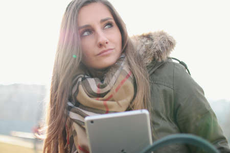 Woman Holding Silver Ipad