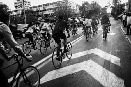People Riding Bicycles on Street