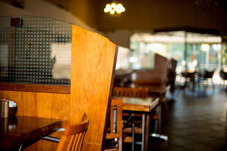 Selective Focus Photography of Brown Wooden Chair