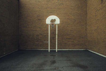 Basketball Ring Near Brown Brick Walls