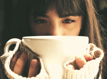 Woman Lifting Mug