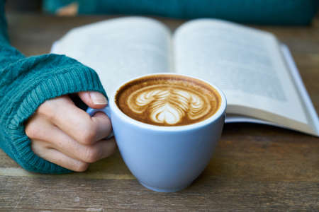 Person Holding Cup of Coffee Latte