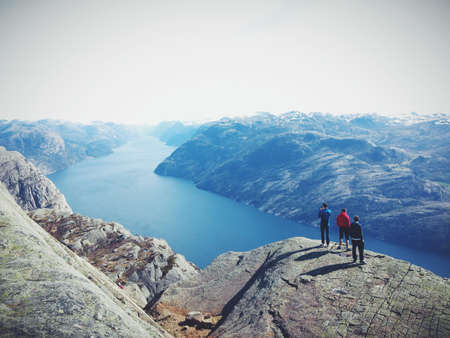 People on Top of Mountain Range