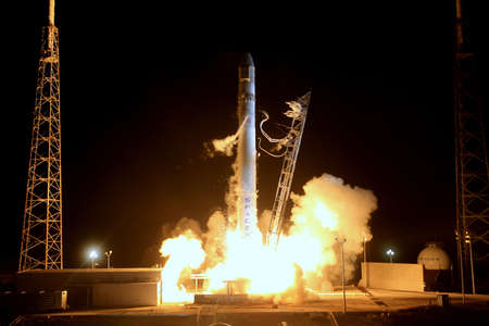 Night rocket liftoff into outer space