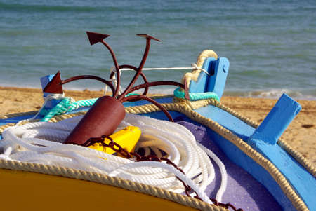 Detail of a a row boat with anchor and ropeの写真素材