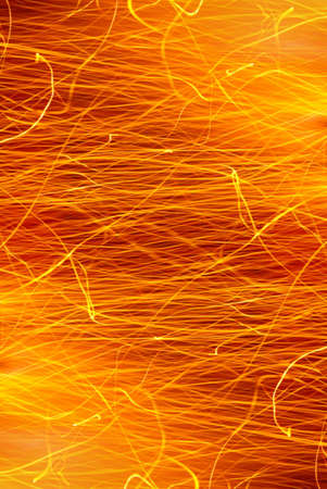 Photo of hot sparks dancing in a barbecue