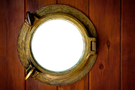 Close-up of a closed boat porthole with wihite backgroundの写真素材