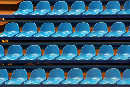 Rows of empty blue chairs for any audience comfortの写真素材
