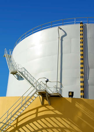 White industrial oil container with stairs in a refineryの写真素材