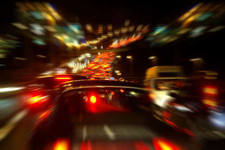 Heavy traffic in a highway in a rush-hour at nightの写真素材