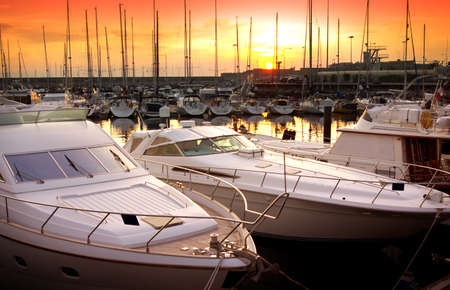 Marina with docked yachts at the end of the dayの写真素材