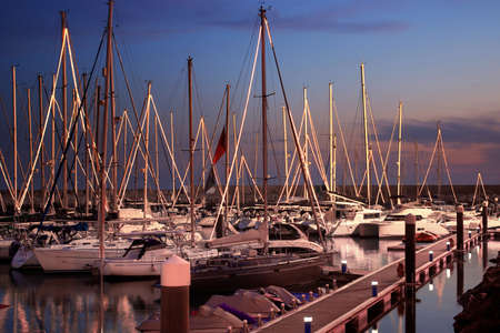 Cal scene of a marina with docked yachts at nightfallの写真素材