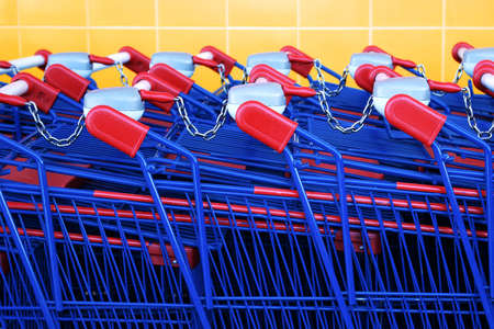 Detail of a row of supermarket karts tidy put togetherの写真素材