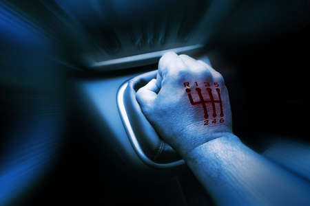 6 speed mark burn in hand on gear stickの写真素材