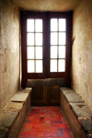 Sof light entering from a old window of a medieval houseのeditorial素材
