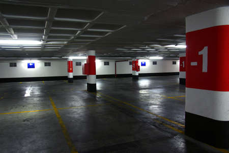 Empty underground parking lot with big concrete columnsのeditorial素材