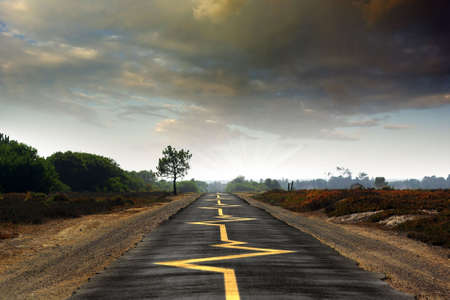 Road with yellow heartbeat monitoring signs - drive safely conceptの写真素材