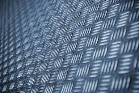 Background photo of a industrial metallic floor with bumpy patternの写真素材
