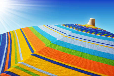 Detail of colorful sunshades in the beach on a sunny summer dayの写真素材
