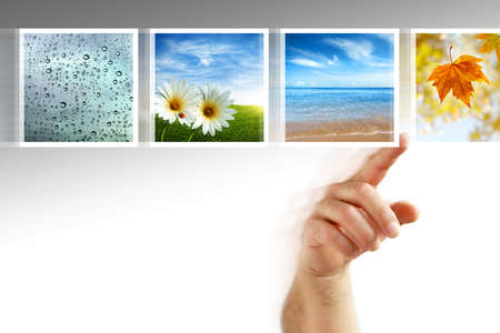 human hand scrolling images in a touch screen of a modern displayの写真素材