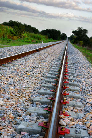 Empty railway in a countryside landscape with tilted horizonの写真素材