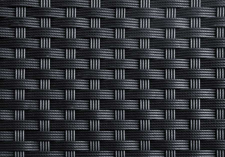 Black textured surface of interlaced nylon stringsの写真素材
