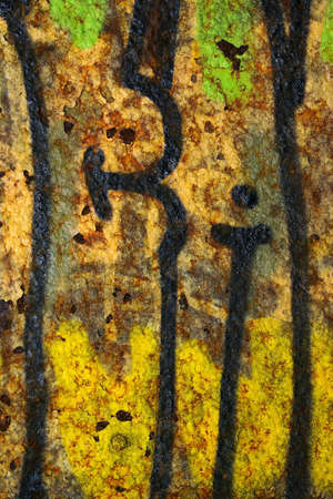Colorful grunge background of rusty iron surface with paint stainsの写真素材