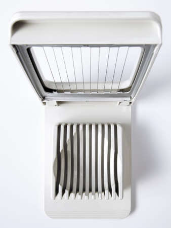 Top view of a egg slicer kitchen utensil isolated in white backgroundの写真素材