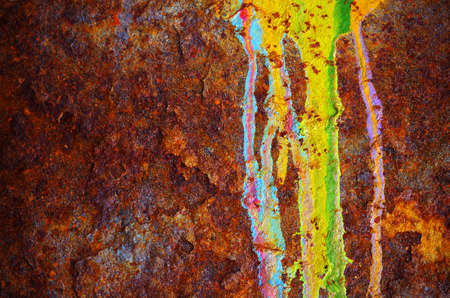 Colorful grunge background of rusty iron surface with paint stains 