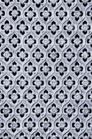 Pattern of tiles of a carved metallic floral artwork の写真素材