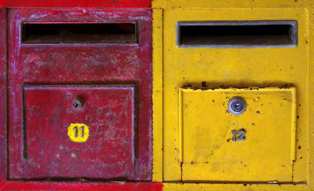 background of colorful old and rusty mailboxes