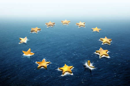 Conceptual image representing the stars of the European Union flag drifting and sinking in the oceanの写真素材