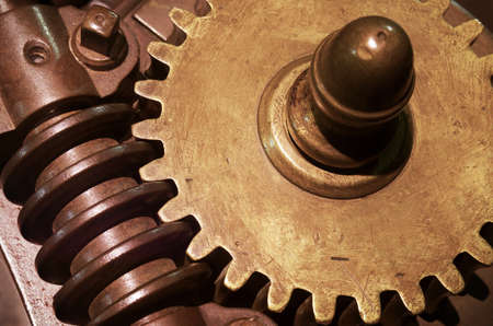 closeup on machanical gear wheels and old industrial machine parts