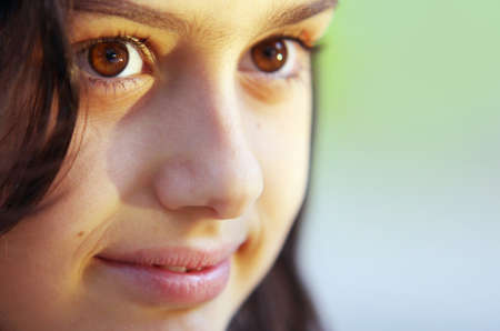 Close-up portrait of a smiling little girlの写真素材
