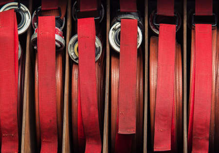 Closeup of several rolls of fire hoses in a firefighter truckの写真素材