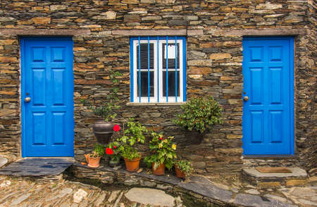 Detail of door in old stone house in a remote portuguese rural villageの写真素材