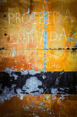 Old colorful rusty metallic surface with peeling paint and scratches