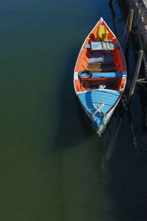 Moored typical colorful boat in the city of Aveiro in Portugalの写真素材