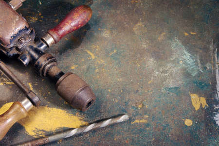 Dirty and stained work table with old rusty tools and space for text