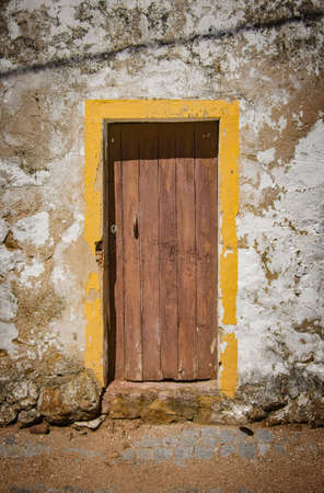 Damaged old wooden door in an abandoned houseの写真素材