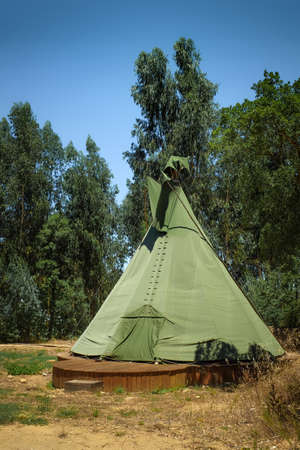Single native american tipi tent in a camping park