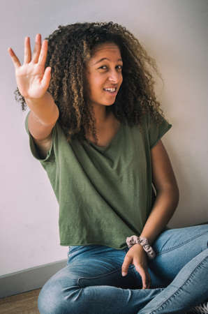 Portrait of teenage girl having fun in photo studio sessionの写真素材