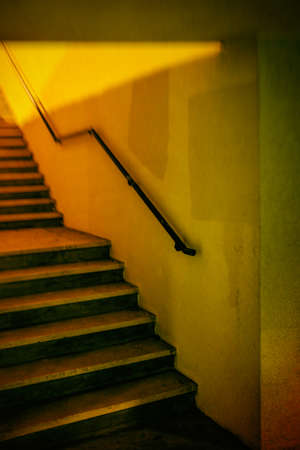 Yellow stairway in an underground passage wayの写真素材